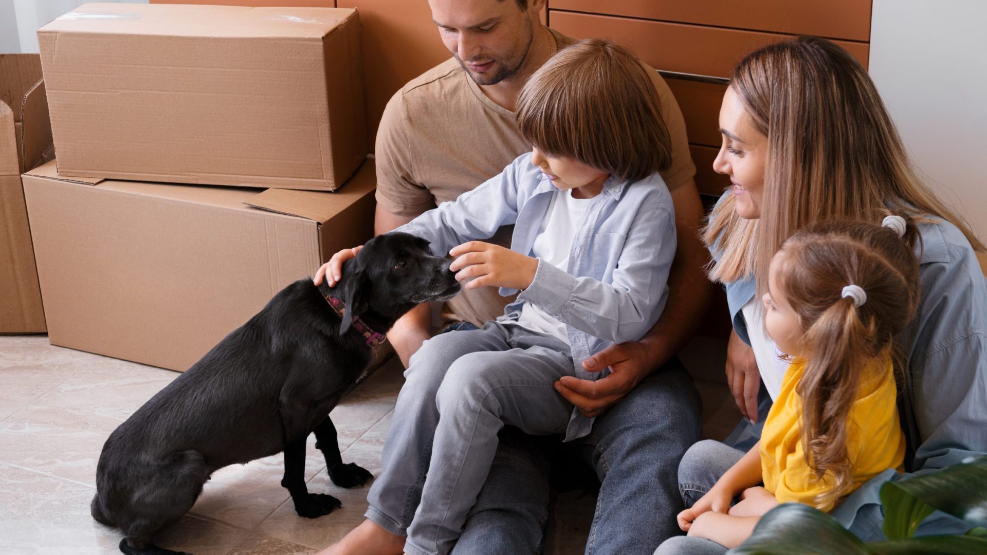 happy-family-with-dog-moving-new-home